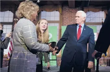  ?? CHARLES KRUPA/AP ?? Former Vice President Mike Pence meets with people Wednesday in Manchester, New Hampshire.