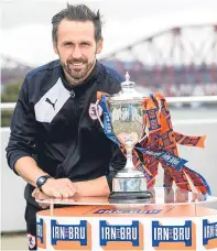  ??  ?? Raith Rovers coach Craig Easton with the Irn Bru Cup after yesterday’s draw at South Queensferr­y.