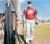  ?? AMY BETH BENNETT/ SOUTH FLORIDA SUN SENTINEL ?? Alan Wolfson, of Delray Beach, hangs up a bat during a game with the Boca Senior Softball league at South County Regional Park west of Boca Raton on Thursday.