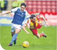  ??  ?? St Johnstone’s Aaron Comrie and Partick Thistle’s Ryan Edwards battle