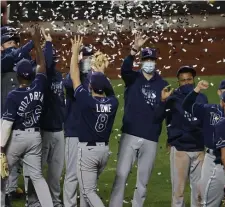  ?? Getty ImaGes ?? WE’RE GOING TO HAVE A CELEBRATIO­N: The Rays popped confetti after clinching the AL East.