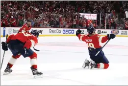  ?? BRUCE BENNETT — GETTY IMAGES ?? Matthew Tkachuk of Panthers celebrates with his teammates after scoring the game-winning goal against the Hurricanes during the third period in Game Four of the Eastern Conference Final of the Stanley Cup Playoffs on Wednesday.