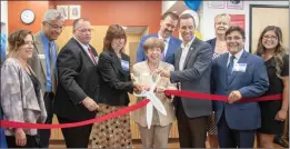  ?? Eddy Martinez/ The Signal (See additional photos at signalscv.com) ?? From left, Kim Wyard, Northeast Valley Health Corp. CEO; Marsha McLean, Santa Clarita mayor pro tem; and Rep. Steve Knight, R-Palmdale, hold the scissors at the ribbon cutting for the Newhall Health Center on Tuesday.