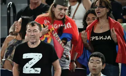  ?? ?? A man wears a 'Z' on his t-shirt as Novak Djokovic of Serbia takes on Andrey Rublev of Russia at the Australian Open. Photograph: Lukas Coch/EPA