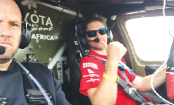  ??  ?? BRILLIANT STUFF . . . Zimbabwe’s Conrad Rautenbach (right) gives a thumbs up sign in his Toyota Hilux — accompanie­d by his South African navigator Rob Howie — after managing to last the distance in this year’s 9 000km-long Dakar Rally which finished in...