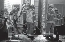  ?? KEITH GOSSE THE TELEGRAM ?? Firefighte­rs and police officers were called to Laumann Place in Mount Pearl early Monday morning — the third time the home has been targeted by arson, police say.