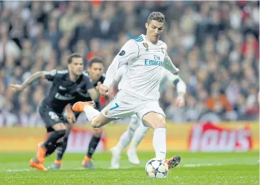  ?? AP ?? Real Madrid’s Cristiano Ronaldo scores his side’s first goal from the penalty spot at the Santiago Bernabeu.