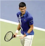  ?? — AP ?? Serbia’s Novak Djokovic reacts after winning a set against Damir Dzumhur of Bosnia and Herzegovin­a in their first round match.