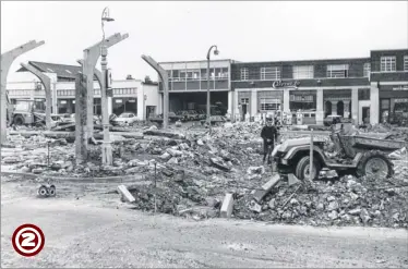  ??  ?? Forge Lane, 1972. Further along the Ringway site, an original section of Forge Lane with its ornate lamp posts is seen being ripped apart. Still trading today as Vauxhall and Skoda dealers at the Orbital Park, Caffyn’s Garage can be seen in one of...