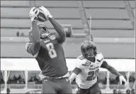  ?? Albert Cesare / AP ?? South Florida wide receiver Tyre McCants (8) catches a touchdown pass in the fourth quarter putting South Florida up on Texas Tech 37-34 during the Birmingham Bowl.