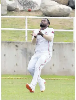  ?? (Photos: Garfield Robinson) ?? Trinidad and Tobago Red Force’s Terrance Hinds takes a catch during the West Indies Championsh­ip seventh-round cricket match against Trinidad and Tobago Red Force at Sabina Park on Friday.