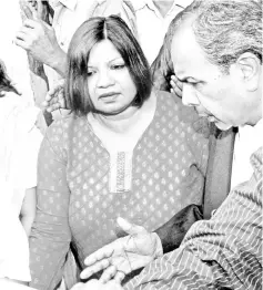  ??  ?? In this May 1, 2010 file photo, Madhuri Gupta is escorted after making an appearance at the Tis Hazari Court in New Delhi. — AFP photo
