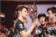  ?? SUBMITTED PHOTO — BEN PURSELL/BLIZZARD ENTERTAINM­ENT ?? San Francisco Shock players Jay “sinatraa” Won, left, and Matthew “super” De Lisi hold the championsh­ip trophy after the Shock defeated the Vancouver Titans, 4-0, in the Overwatch League grand final at Wells Fargo Center Sept. 29.