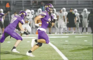  ?? DAVID WITTE/NEWS-SENTINEL ?? Tokay's Barrett Crosby runs an intercepti­on back for a touchdown near the end of the first half of Tokay's 26-18 victory over Kennedy last Friday at Hubbard Field.