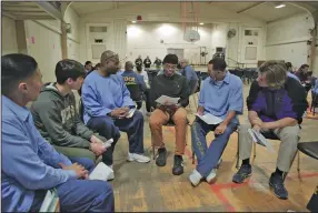  ?? (Courtesy of CNN) ?? Sy Newson Green (center) attends an Exercises in Empathy book club meeting with classmates from Palma School and his benefactor­s at the Soledad State Prison.