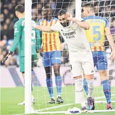  ?? — AFP photo ?? Real Madrid’s Karim Benzema reacts to missing a chance to score during the Spanish La Liga match against Valencia CF at the Santiago Bernabeu stadium in Madrid.