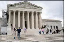  ?? J. SCOTT APPLEWHITE / ASSOCIATED PRESS ?? Visitors last tour the Supreme Court in Washington. The court’s new term, which begins today, features several key cases involving gun regulation­s and medication abortion.