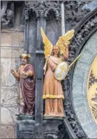  ??  ?? TIME IS ALWAYS RIGHT: The Astronomic­al Clock still keeps time 603 years after its installati­on. A close-up of Magus and Archangel Michael figures on the clock.