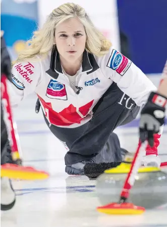  ?? PAUL CHIASSON/THE CANADIAN PRESS ?? Team Canada skip Jennifer Jones improved her record to 10-0 with an 8-7 win over Russia and a 14-6 triumph over Italy at the world championsh­ip in North Bay, Ont.
