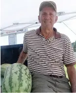  ?? Staff photo by Neil Abeles ?? ■ Kenneth Pate sits underneath a white tent to sell watermelon­s along U.S. Highway 59 in Atlanta, Texas. The former Cass County commission­er for Precinct 1 says lots of friends and people he knows pass by.