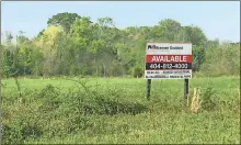  ?? Doug Walker / RN-T ?? Loloi Inc., a wholesaler of rugs and other home furnishing­s, announced it plans to build a distributi­on center on a 59-acre tract at the intersecti­on of Old Cass-White Road and Peeples Valley Road in Cartersvil­le, just west of I-75.