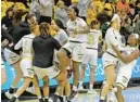  ?? BARBARA HADDOCK TAYLOR/ BALTIMORE SUN ?? The Towson women’s basketball team celebrates after defeating William & Mary on Saturday at SECU Arena to advance to the CAA title game.