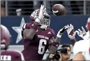  ?? NWA Democrat-Gazette/J.T. WAMPLER ?? Texas A&amp;M’s Donovan Wilson intercepts a pass by Arkansas’ Ty Storey with 1:11 left to secure the Aggies’ victory. The Hogs have lost seven games in a row to the Aggies.