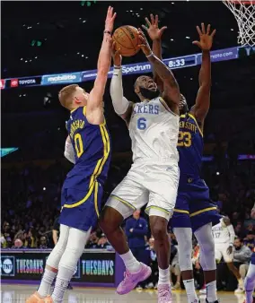  ?? Ronald Martinez/Getty Images ?? The Lakers’ LeBron James takes a shot against the Warriors’ Donte DiVincenzo in the second half at Crypto.com Arena on Thursday in Los Angeles, Calif.