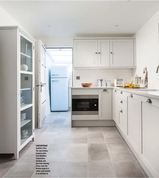  ??  ?? CONTEMPORA­RY CLASSIC STYLE The new kitchen features units from Howdens, Caesarston­e worktops and porcelain flooring. A door from the kitchen leads to a utility room located in an old lean-to.