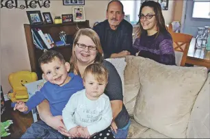  ?? SALLY COLE/THE GUARDIAN ?? Don Gray and executive director Becky Mullen visit homeowner Bethany Robinson and her children, Graysen, 3, left, and Brynnlee, 1, in Harrington. Missing from the photo is Bethany’s husband, Michael Robinson.