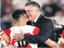  ?? PHOTO: GETTY IMAGES ?? Japan head coach Jamie Joseph embraces one of the players, Yu Tamura, following the team’s win against Scotland in Yokohama on Sunday night.