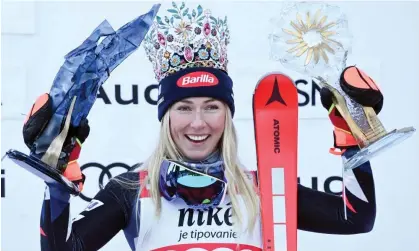  ?? Photograph: Vladimír Šimíček/AFP/Getty Images ?? Mikaela Shiffrin celebrates on the podium after the women's slalom in Jasna, Slovakia.