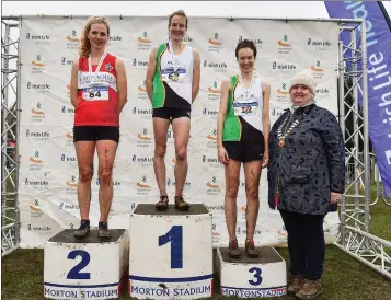  ??  ?? SeniorWome­n’s medallists from left, Mary Mulhare of Portlaoise A.C., Co. Laois, silver, Fionnuala McCormack, gold, and Una Britton, bronze, with Athletics Ireland President Georgina Drumm during the Irish Life Health National Senior, Junior and Juvenile Even Age Cross Country Championsh­ips.