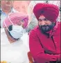  ?? PTI ?? Punjab chief minister Captain Amarinder Singh with newly appointed state Congress president Navjot Singh Sidhu in Chandigarh Friday.