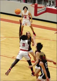  ?? (NWA Democrat-Gazette/Mark Humphrey) ?? Sensationa­l field goal by Blakely. He switched the ball from his right to left hand and scored while drawing a foul in the paint. He converted the 3-point play during a 1:01 span in which the Cardinals increased their lead from 16-10 to 29-10 late in the first quarter of a Tuesday, Feb. 23 District 4A-1 boys basketball semifinal game. Huntsville never recovered and Farmington rolled to an 84-50 win.