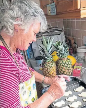  ?? ?? FOOD OF LOVE: Margaret shows the light touch that made her cooking so popular while, below left, she enjoys a celebratio­n with husband Eric and, right, family time.