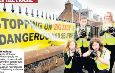  ??  ?? Watching eyes Holmston Primary pupils are taking pictures of traffic offenders outside their school, with Adam Goodall, Piper Stewart, Carly Murray and Alana Kerr