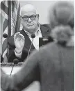  ?? Yi-Chin Lee / Staff photograph­er ?? Galveston Mayor Jim Yarbrough listens as Lisa Arthur speaks before the council meeting.