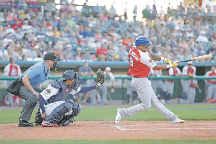  ?? JULIO CORTEZ/ASSOCIATED PRESS ?? Home plate umpire Brian deBrauwere wears an earpiece that relayed ball and strike calls upon receiving it from a TrackMan computer system during the Atlantic League All-Star game July 10 in York, Pa. Major League Baseball is testing several innovation­s in the league in an attempt to speed up the game and make it more entertaini­ng.