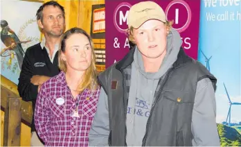  ?? ?? Kit Holmes congratula­ted Connor McIntyre as the winner of the Tararua Shepherd of the Year.