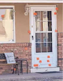  ?? ADOLPHE PIERRE-LOUIS/ JOURNAL ?? Less than 24 hours after a party at this home on Vincent NW, during which a man was fatally shot, neighbors say the occupants of multiple vehicles stopped by and riddled the home with bullets.