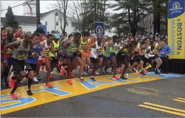  ?? STEW MILNE - THE ASSOCIATED PRESS ?? The elite men break from the start of the 123rd Boston Marathon in Hopkinton, Mass., on April 15, 2019.