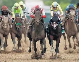  ?? Patrick Smith Getty Images ?? CLOUD COMPUTING, center left, with jockey Javier Castellano, charges past Classic Empire and Julien Leparoux. Derby winner Always Dreaming was eighth.