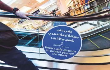  ?? Ahmed Ramzan/ Gulf News ?? Shoppers are requested to follow social distancing requiremen­ts at all times while they are inside malls as the establishm­ents are returning to 100 per cent operationa­l capacity in Dubai.