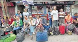  ?? PTI ?? Stranded tourists wait at a bus stand during the indefinite strike called by Gorkha Janamukti Morcha in Darjeeling on Monday.