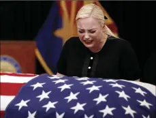  ?? AP PHOTO/JAE C. HONG, POOL ?? Meghan McCain, daughter of, Sen. John McCain, R-Ariz. cries at the casket of her father during a memorial service at the Arizona Capitol on Wednesday in Phoenix.