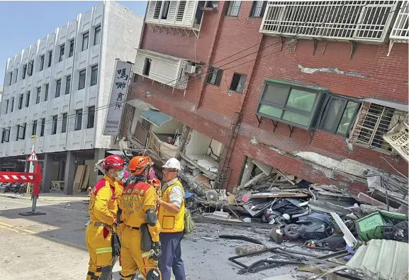  ?? Photo: Reuters ?? Firefighte­rs work at the site where a building collapsed following the earthquake, in Hualien, Taiwan, in this handout provided by Taiwan’s National Fire Agency on April 3, 2024.