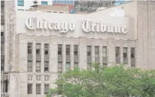  ?? | SUN- TIMES LIBRARY ?? Chicago Tribune parent company Tronc reported declining revenue in the third quarter but raised its profit forecast.