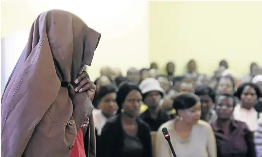  ?? /ANTONIO MUCHAVE ?? A pastor who allegedly raped four teenagers in Burgersdor­p, outside Tzaneen, hides his face under a jacket as he appeared in the Lenyenye Magistrate’s Court in Limpopo yesterday.