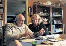  ?? JASON KRYK/POSTMEDIA NETWORK ?? Vern and Marie Harvey, of Windsor, discovered these photos, letters and medals in a box that belonged to Marie's late father, Pte. Lawrence Johnson, a Peterborou­gh soldier who fought in the Battle of Passchenda­ele during the First World War.